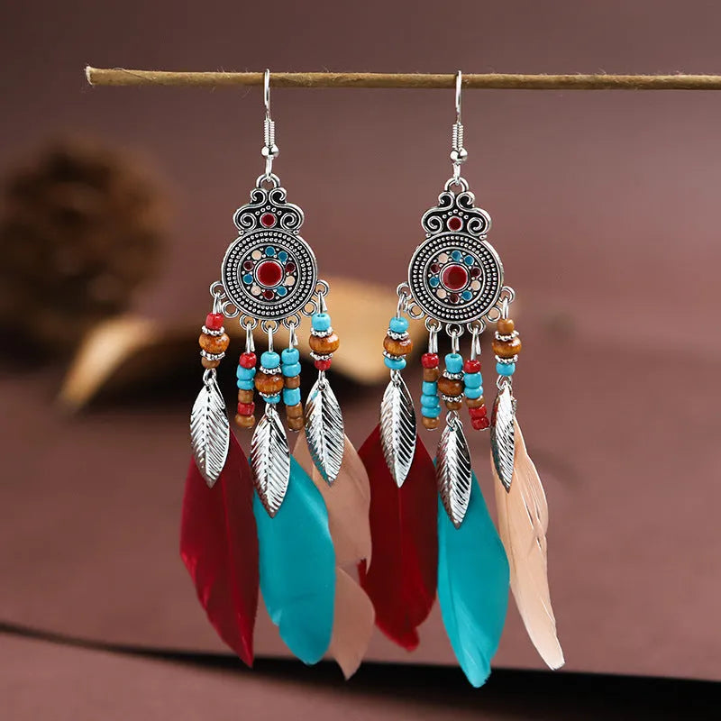Round drop feather earrings with leaf detailing in various bohemian colours
