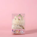 Cat wearing princess crown headdress with lace veil in beige or pink
