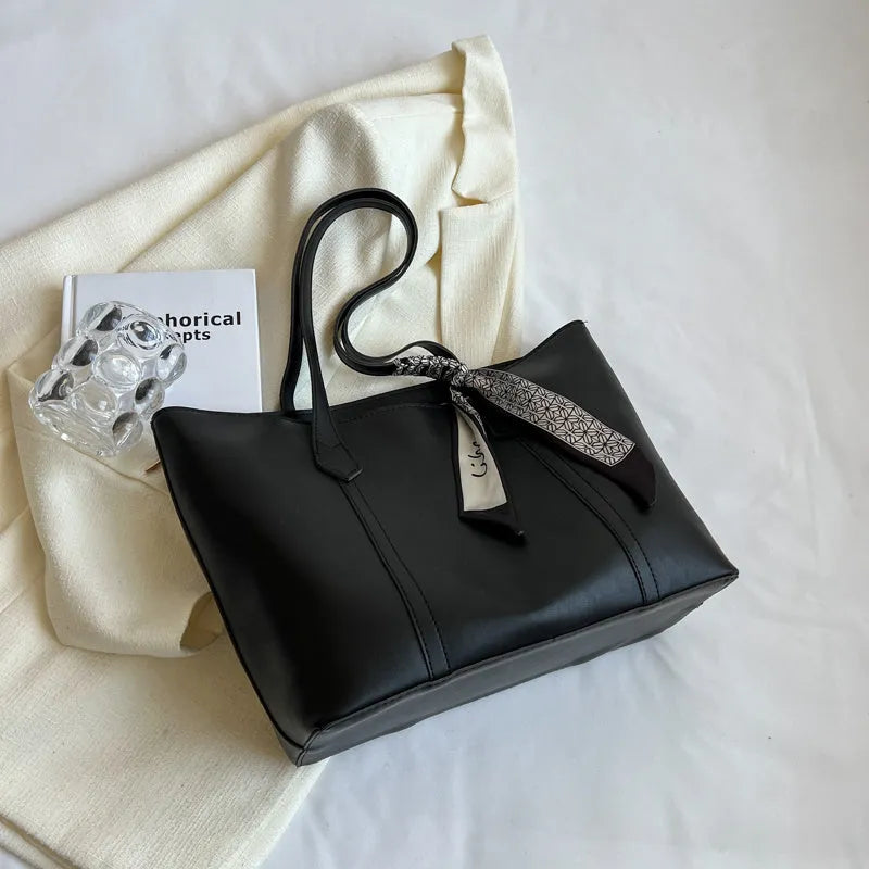 Large capacity bucket tote bag with soft construction and sandwich pocket design