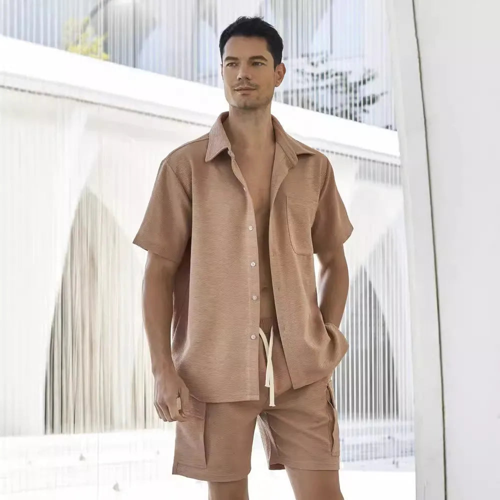 Women's beige elastic waist shorts and short sleeve top two-piece casual set laid flat.
