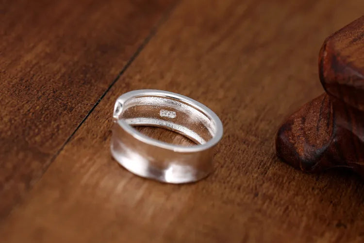 Geometric adjustable open ring with frosted sterling silver finish and Korean-inspired design