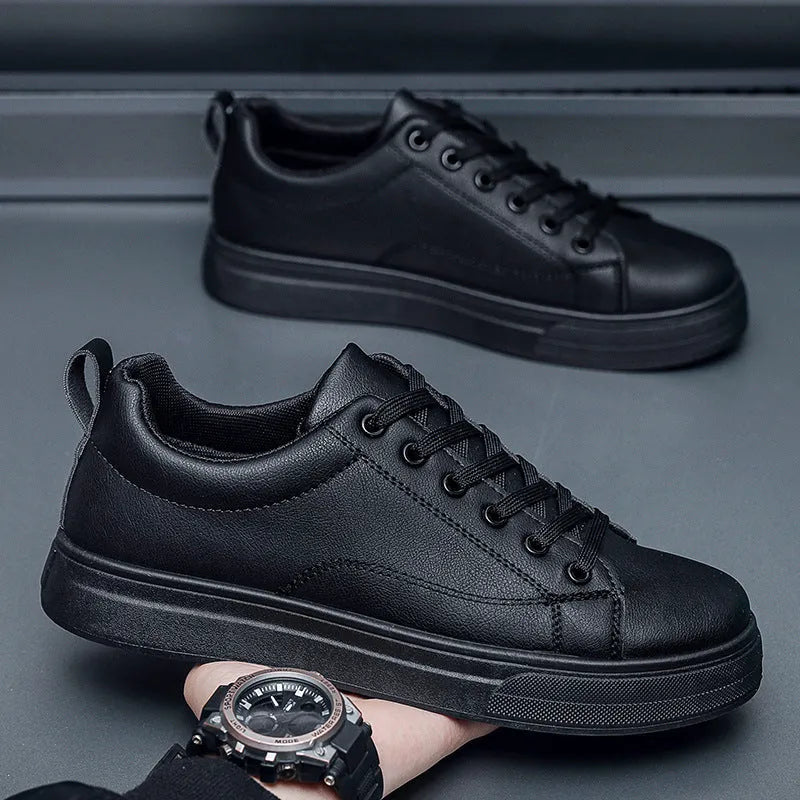 Men's Korean-style low-top sneakers in all black colour with round toe and rubber sole