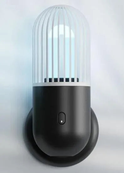 Portable capsule ultraviolet disinfection lamp in black, brown, green or white with display showing 52x52x136mm dimensions