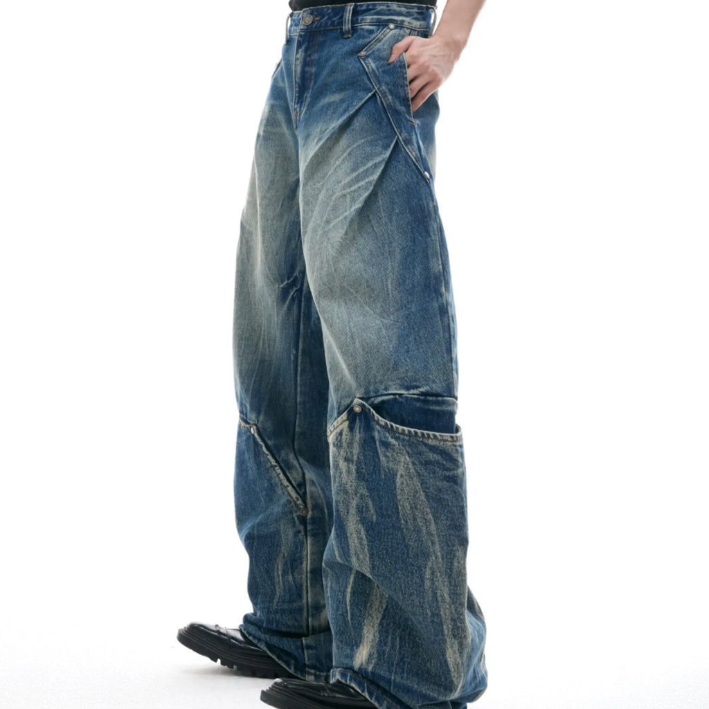 Men's verdant blue curved knife jeans with washed burst pattern and loose fit design
