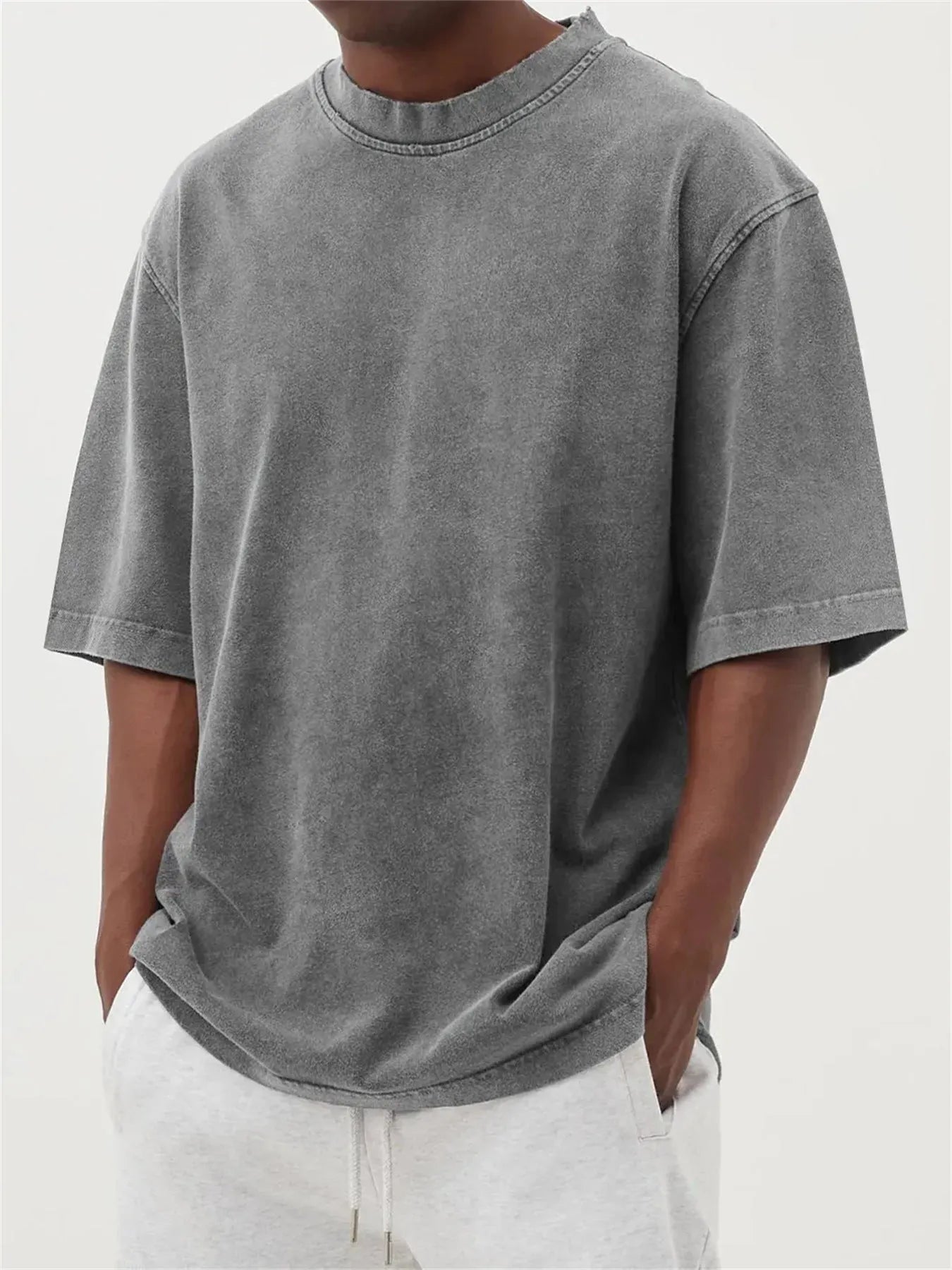 Men's washed distressed pullover t-shirt in solid colour with loose fit and stone washed finish