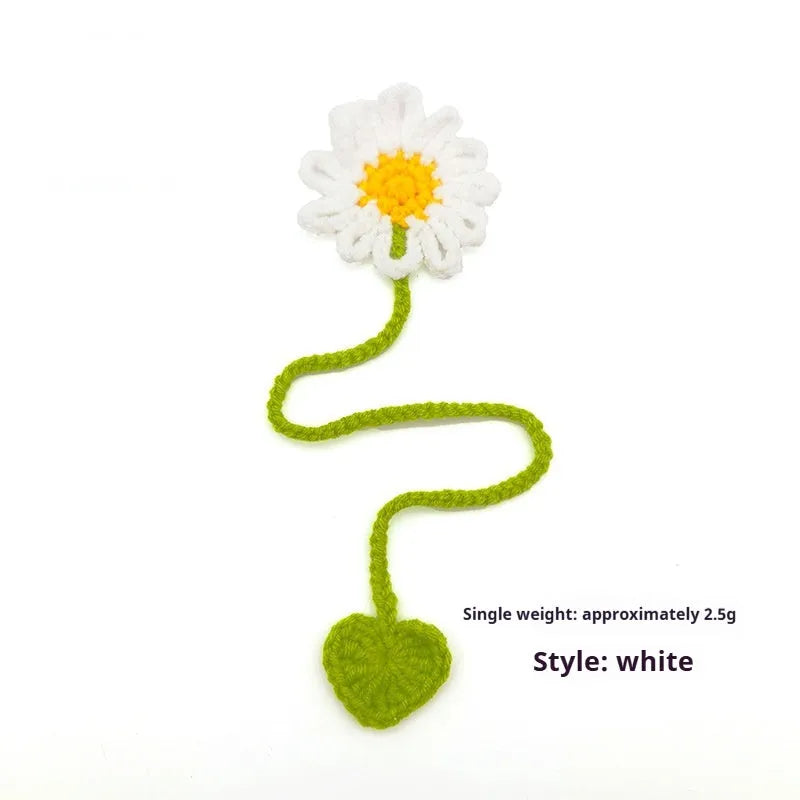 Hand-crocheted daisy flexible wire bookmark in yellow, pink, light purple, and orange colours.