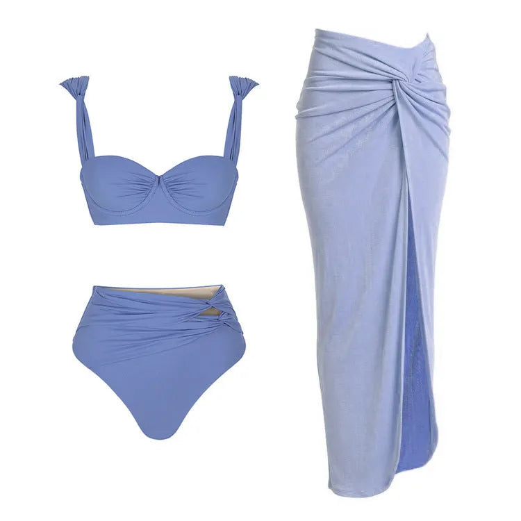 Women's solid colour one-piece swimsuit with gold buttons and matching skirt