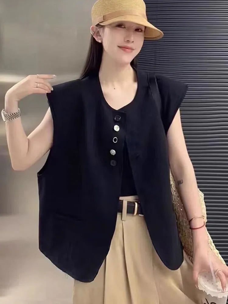 Women's loose fit polyester vest in milky white with pocket detail and 40cm length