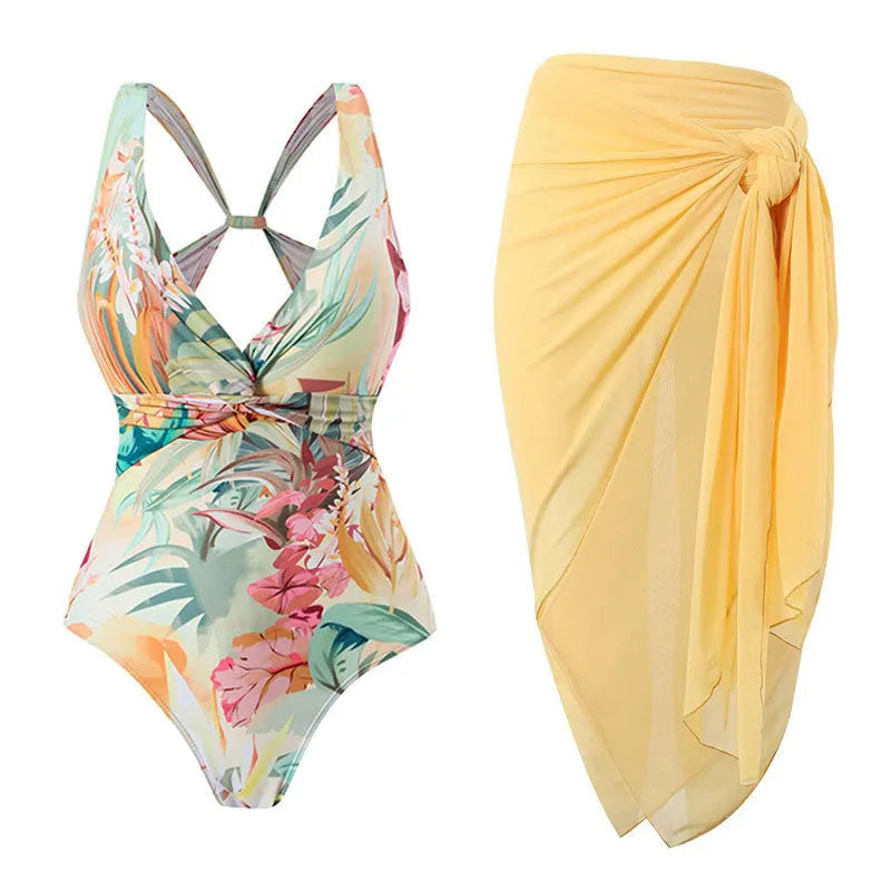 Yellow floral vintage print conservative one-piece swimsuit with short sleeves on a mannequin