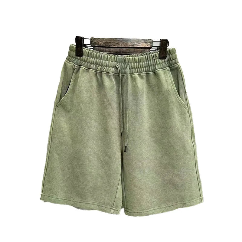Men's cotton shorts with distressed detailing in straight-leg loose fit