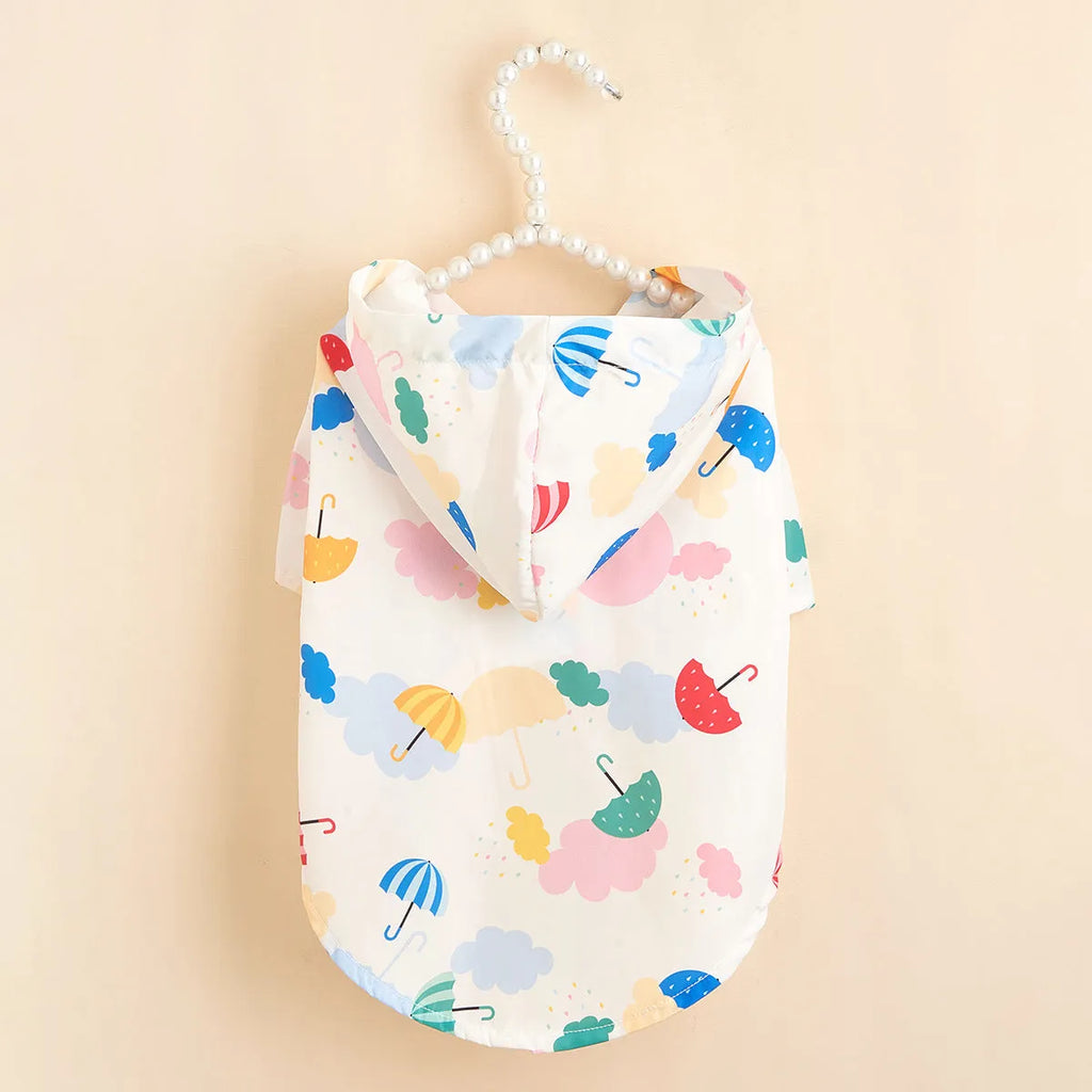 Colourful cartoon umbrella print dog raincoat in polyester fabric.