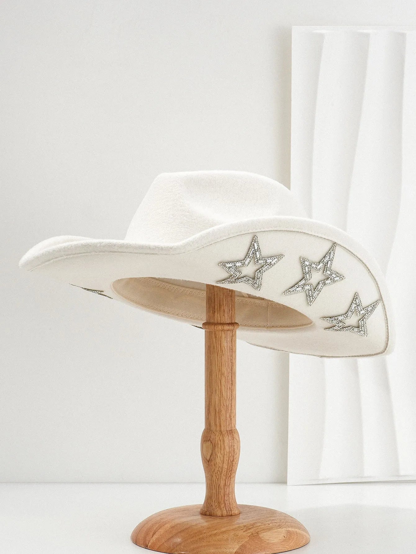 Brown polyester western-style top hat with a conical crown and a silver hexagonal star decoration on the front.