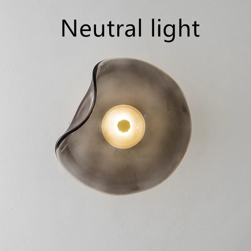 Round decorative wall lamp with glass shade for bedroom bedside lighting