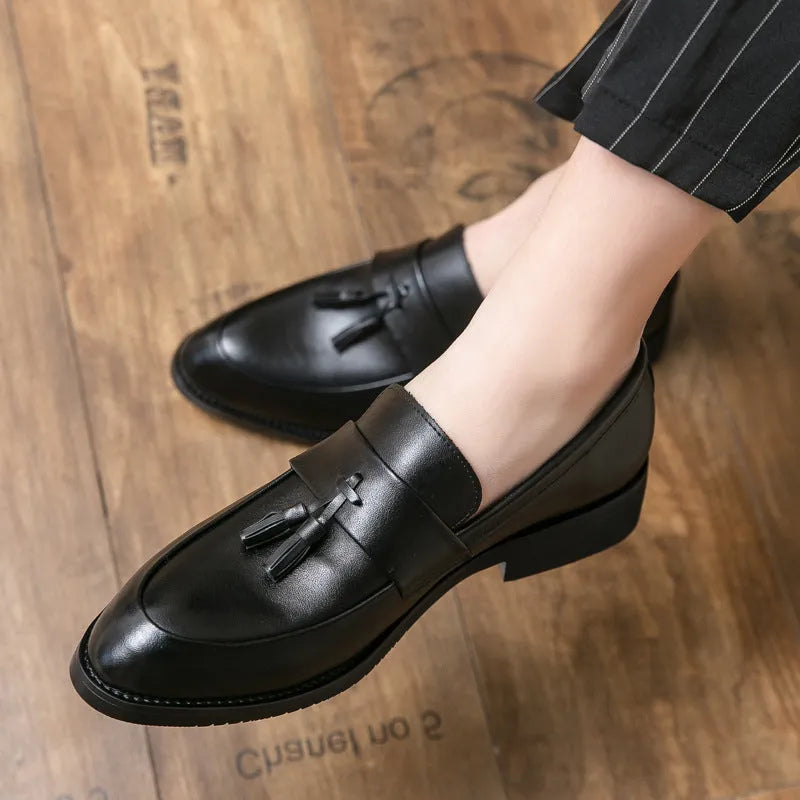Men's black and brown business casual slip-on shoes with tassel detail and rubber soles
