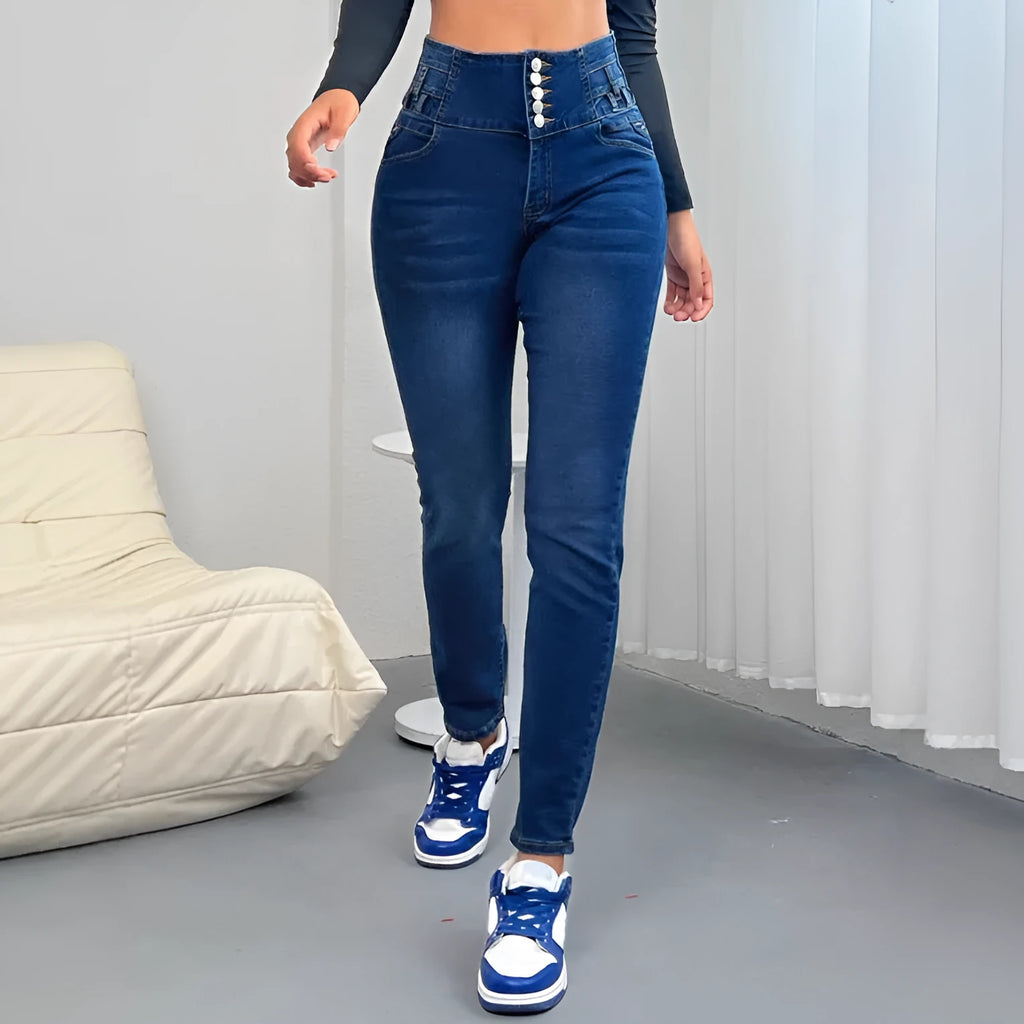 Women's dark blue straight-leg denim trousers with button-fly closure on hanger