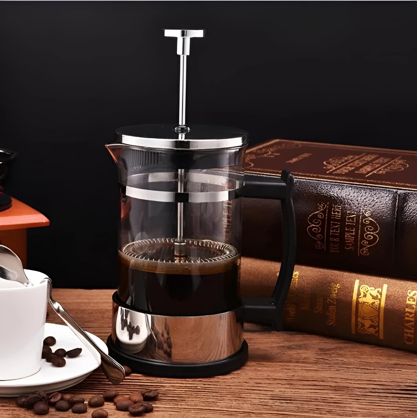 Compact 350ml manual pour-over coffee maker with glass carafe and stainless steel filter.