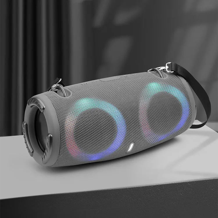 War Drum portable Bluetooth speaker with RGB lights in camouflage colour with carrying strap.