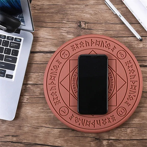 Square wireless phone charger with magic array pattern showing black colour option on desk surface