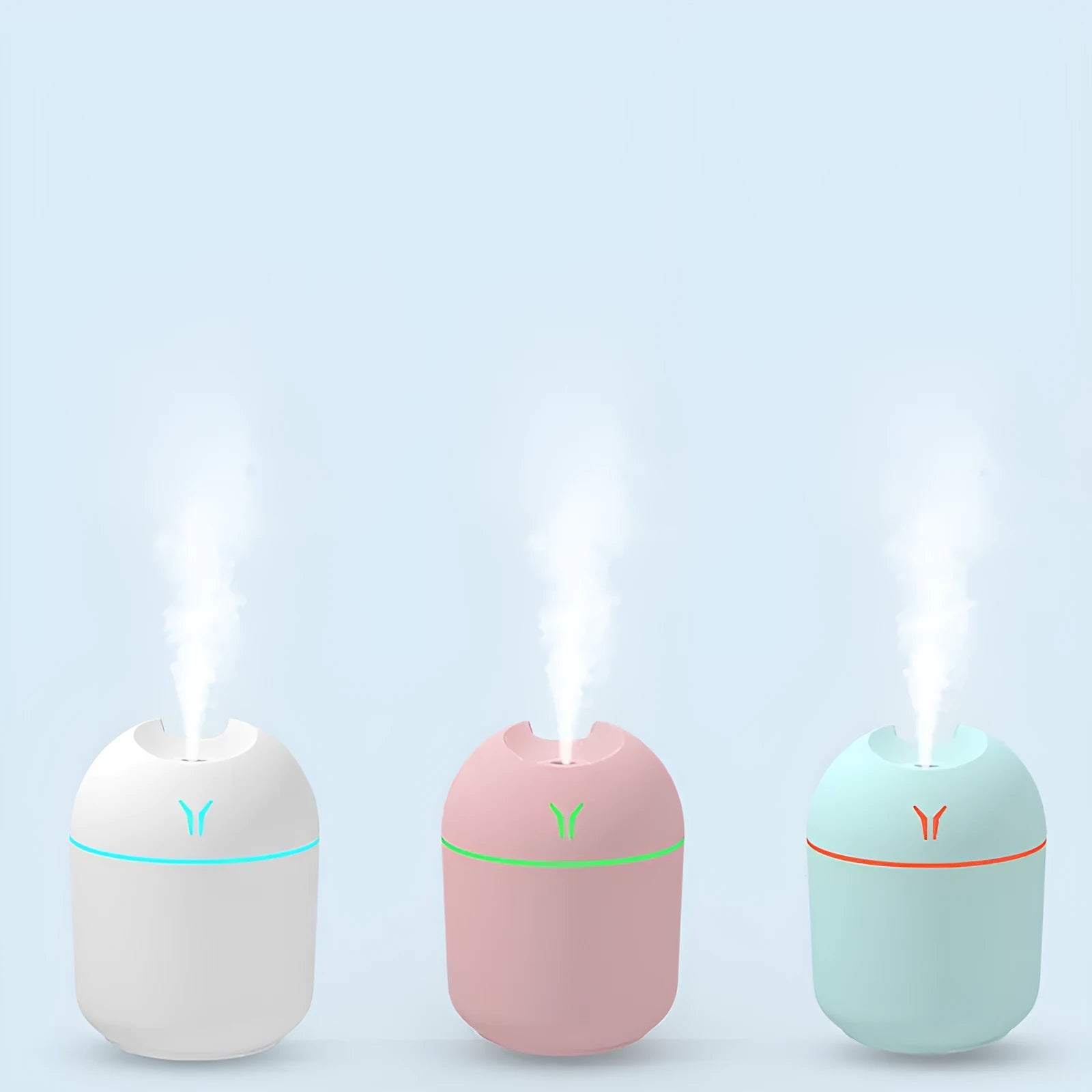 Mini round desktop and car humidifier with USB cable in ivory white, sky blue, or pink.