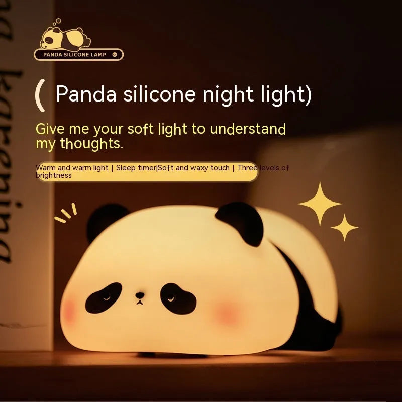 White panda-shaped night light with black accents measuring 150mm tall with USB charging port