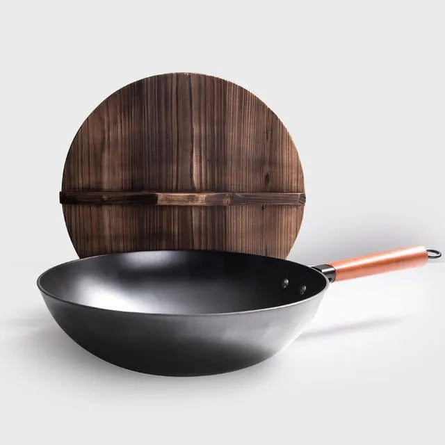 Traditional black iron wok pan with wooden handle measuring 40cm
