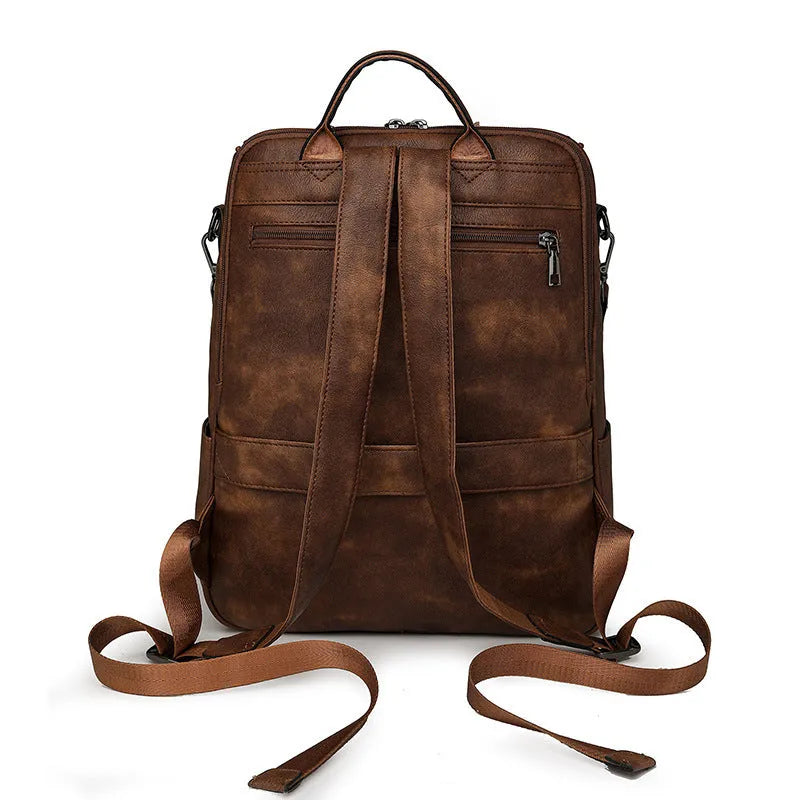 Retro college backpack in black PU leather with curved shoulder straps and stitching details