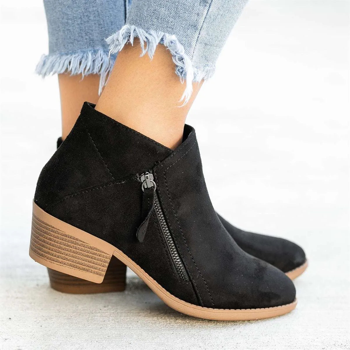 Women's suede ankle boots with side zip and chunky heel in beige, black, blue, or orange.