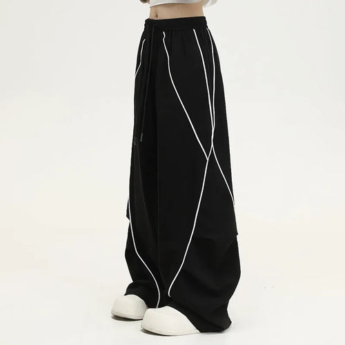 Black pleated wide-leg hip hop pants with striped pattern and mid waist, loose fit polyester streetwear trousers