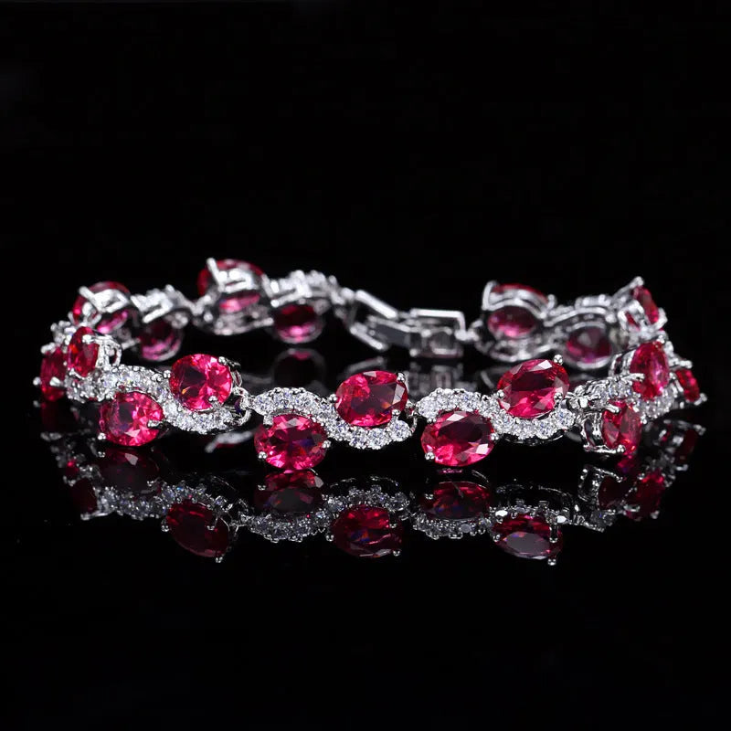 Geometric gold electroplated women's bracelet with inlaid zircon stones, shown in one of five colour options.