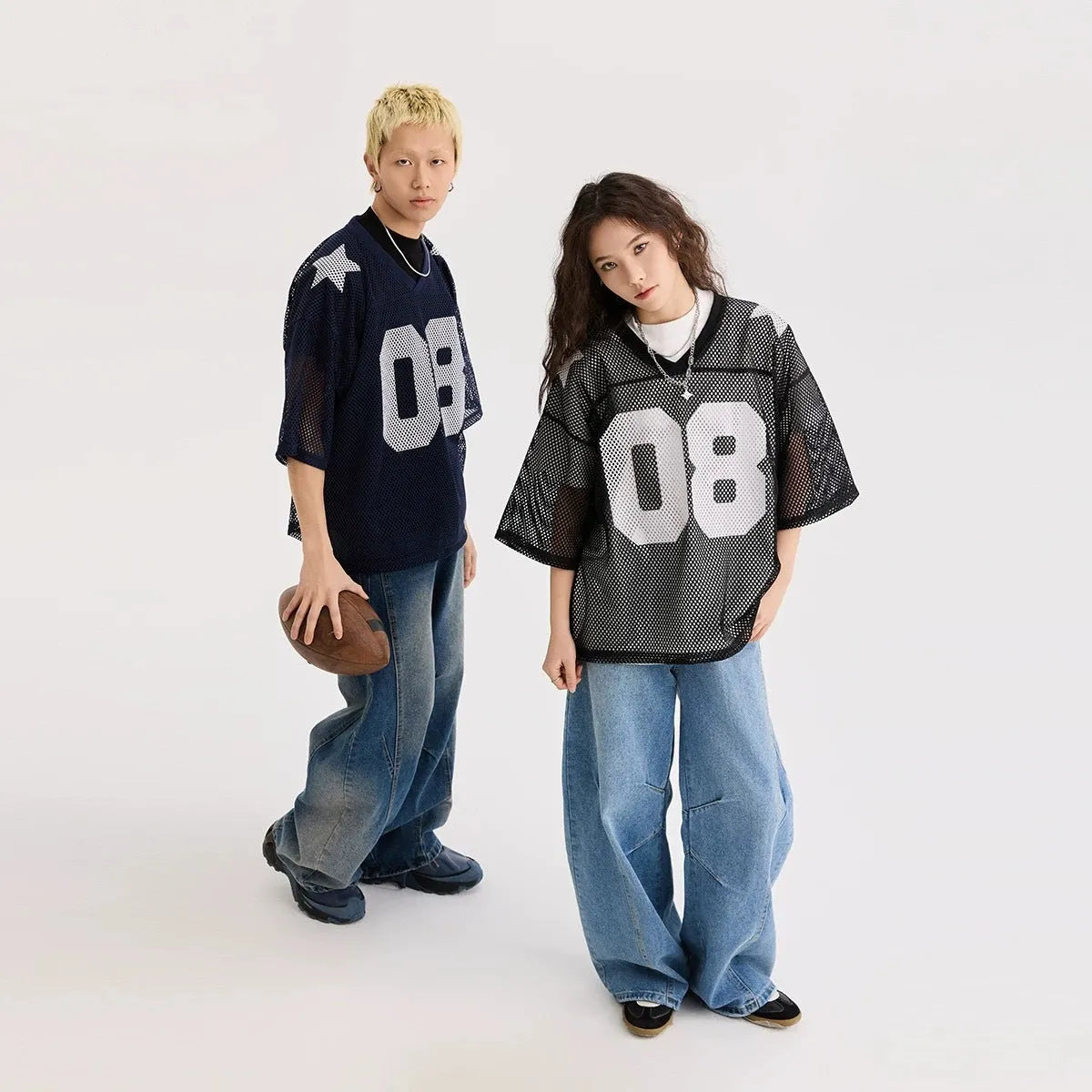 Black loose-fit short sleeve shirt with white letter print pattern, modelled flat