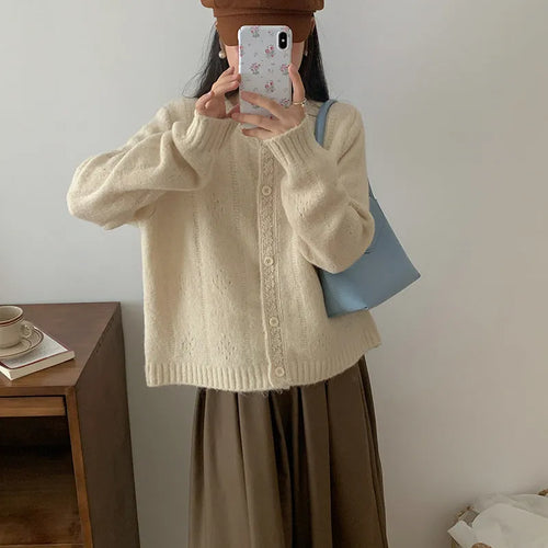 Artistic retro loose-fit sweater coat in viscose fibre, shown in apricot colour.