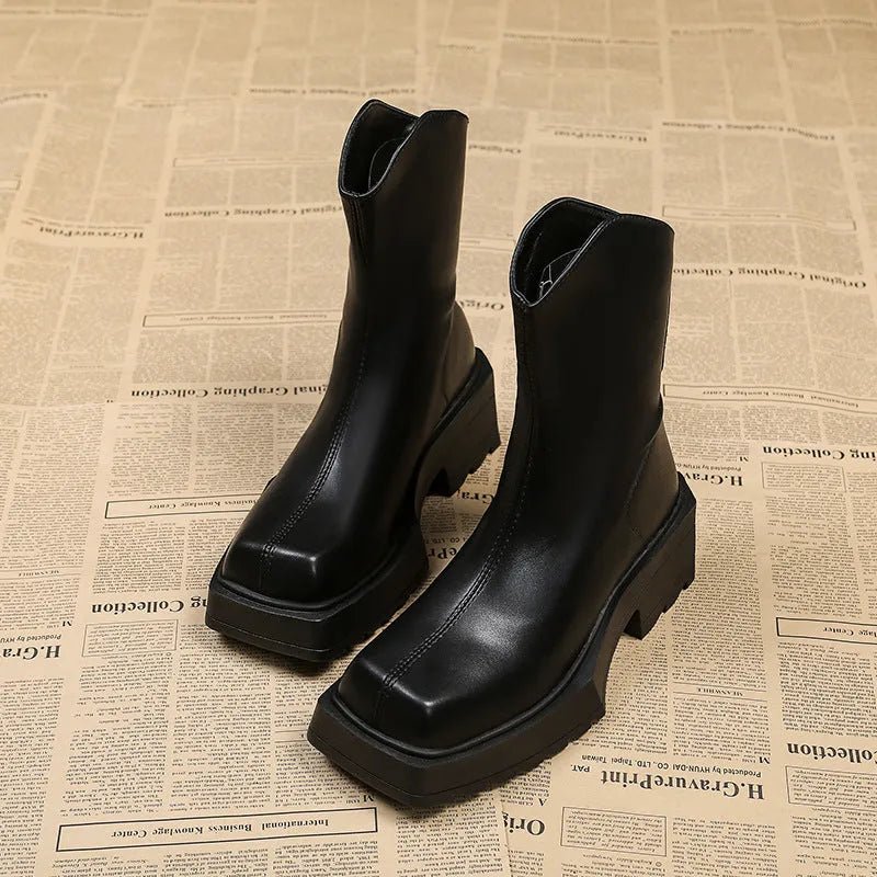 Black platform Martin boots for women with square toe, high heel, and back zipper.