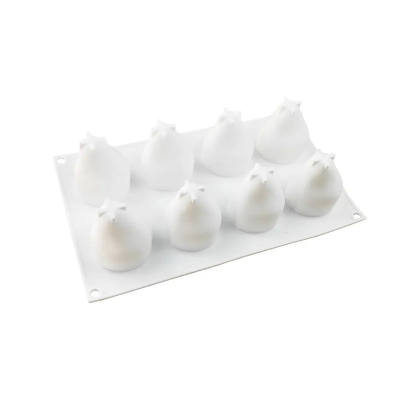 Set of six flexible silicone baking moulds showing pear, pine cone, and pineapple fruit designs.