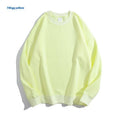 A loose-fitting, off shoulder, round neck cotton sweater in a solid colour with long sleeves.