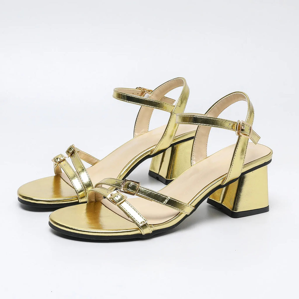 Gold plus size thick high heel buckle women's sandals on display