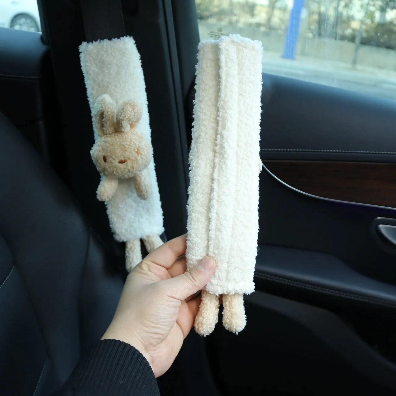 Cartoon plush lamb wool seatbelt shoulder protector in bear and rabbit designs.