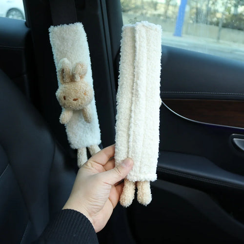 Cartoon plush lamb wool seatbelt shoulder protector in bear and rabbit designs.