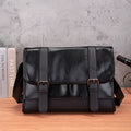 Black Korean-style men's commuter backpack with anti-theft feature and sewing thread detailing.