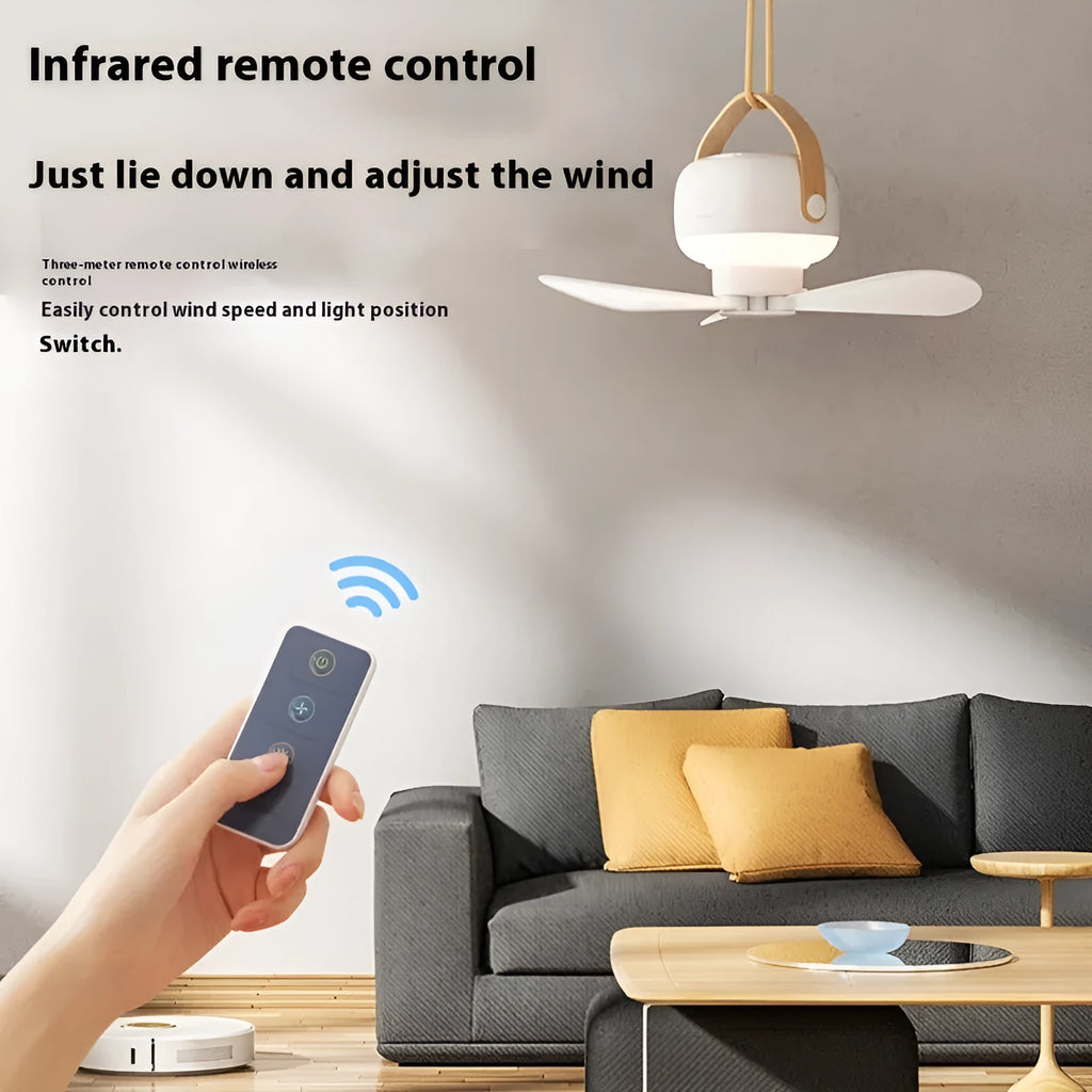 Small white rechargeable ceiling fan with remote control and strap for camping.