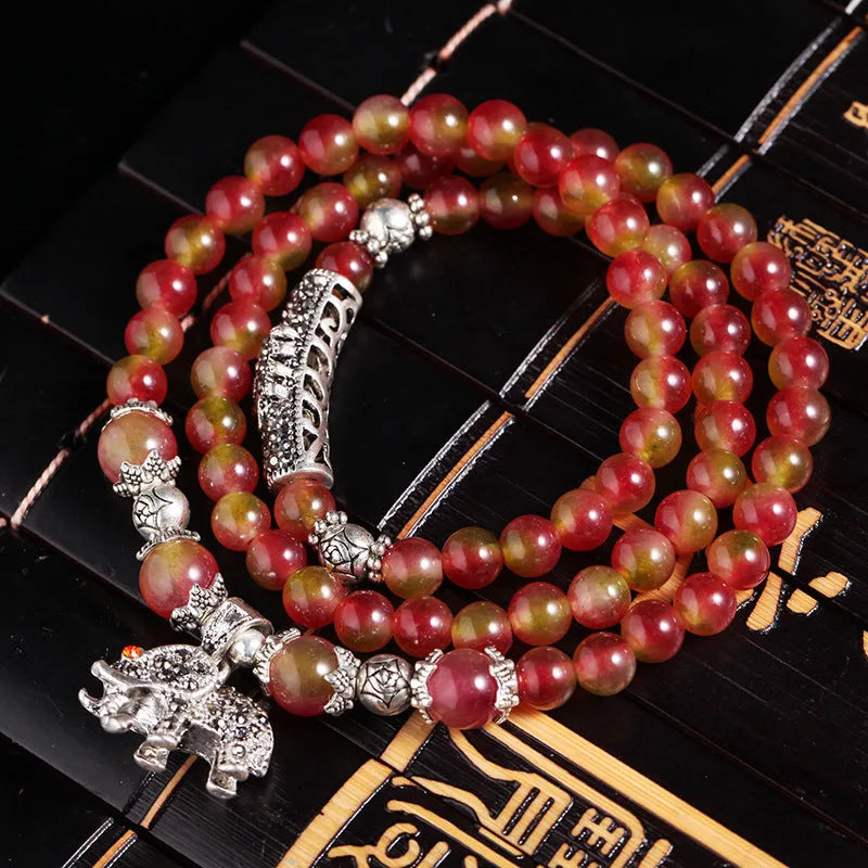 Handcrafted natural watermelon crystal bracelet with geometric beads and Chinese knot adjustable closure