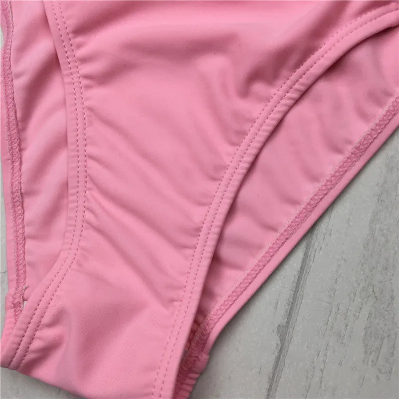 Women's pink bandage halter bikini swimsuit with cut out cross front design