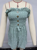 Women's sleeveless off-shoulder jumpsuit in solid colour with elastic waist and button details