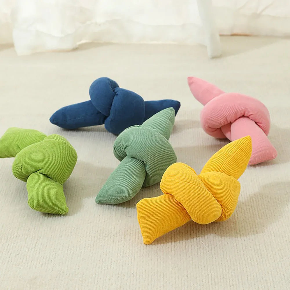 White cotton dog rope toy with multiple sturdy knots for tug of war and chewing