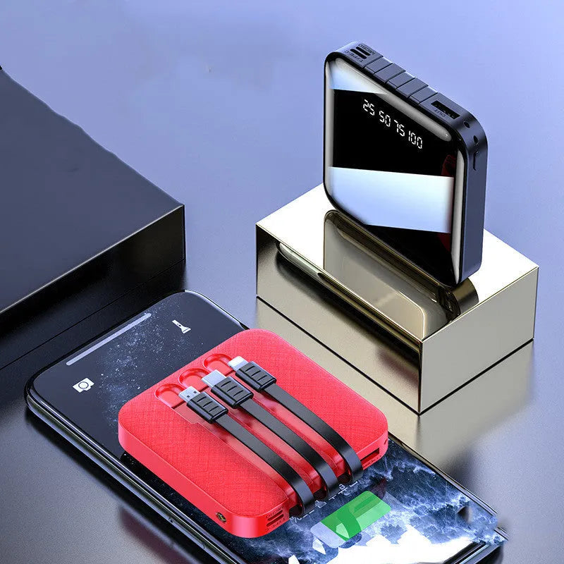 Black and red portable power bank with built-in charging cable, showing compact size