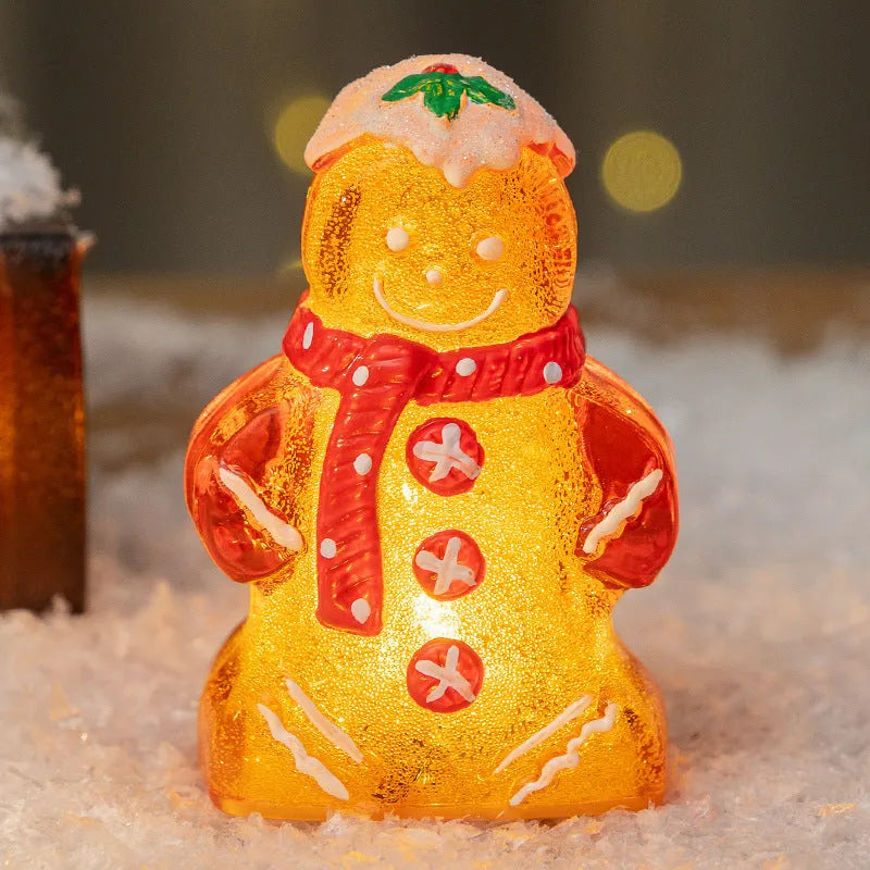 Set of four glowing Christmas gingerbread man and snowman ornaments with different coloured scarves on a festive background.