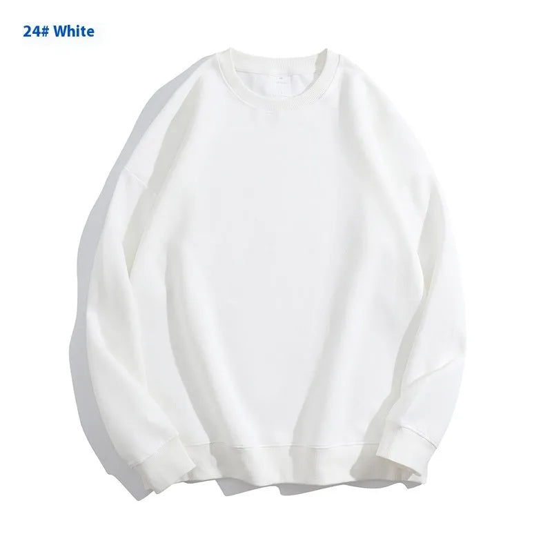 A loose-fitting, off shoulder, round neck cotton sweater in a solid colour with long sleeves.