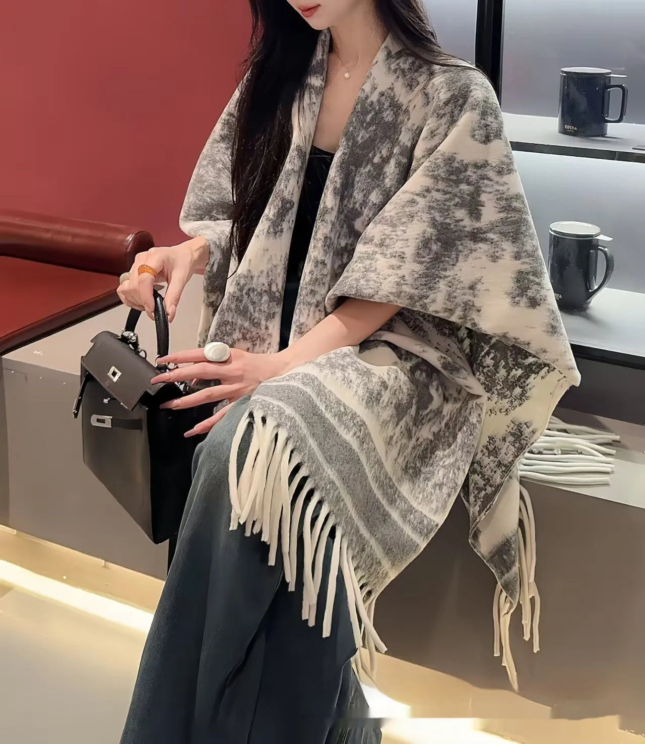 Women's polyester scarf cape with tassel edges in shawl style, shown in one of five available colours