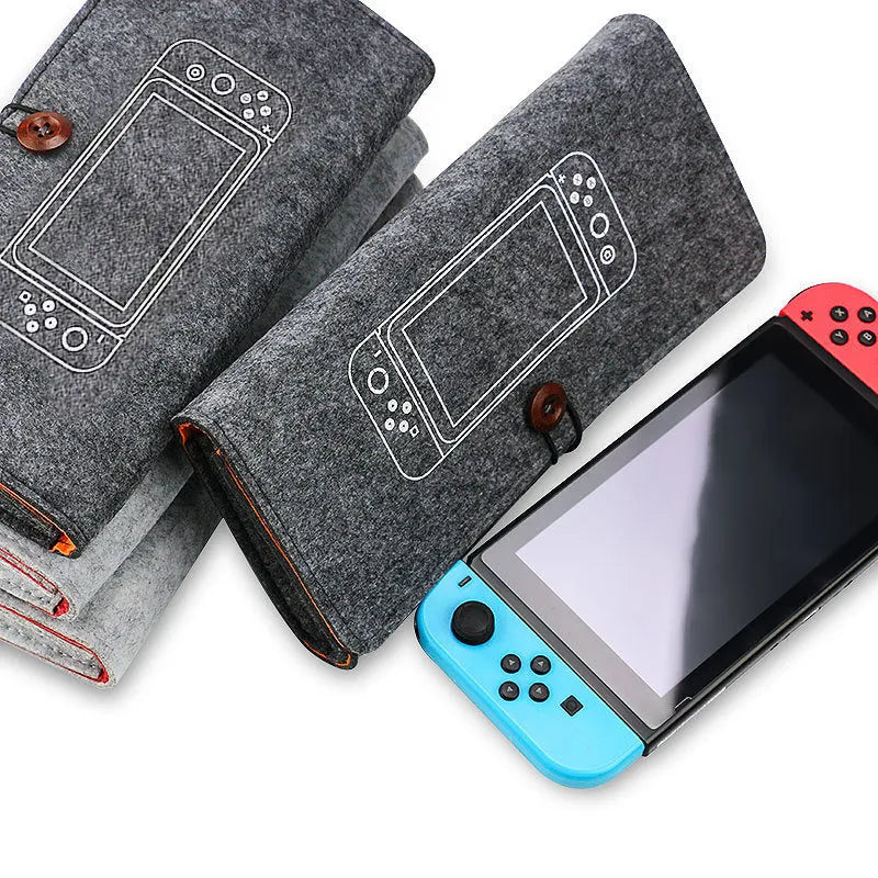 Black felt carrying pouch for Nintendo Switch console with game card slots and storage compartments