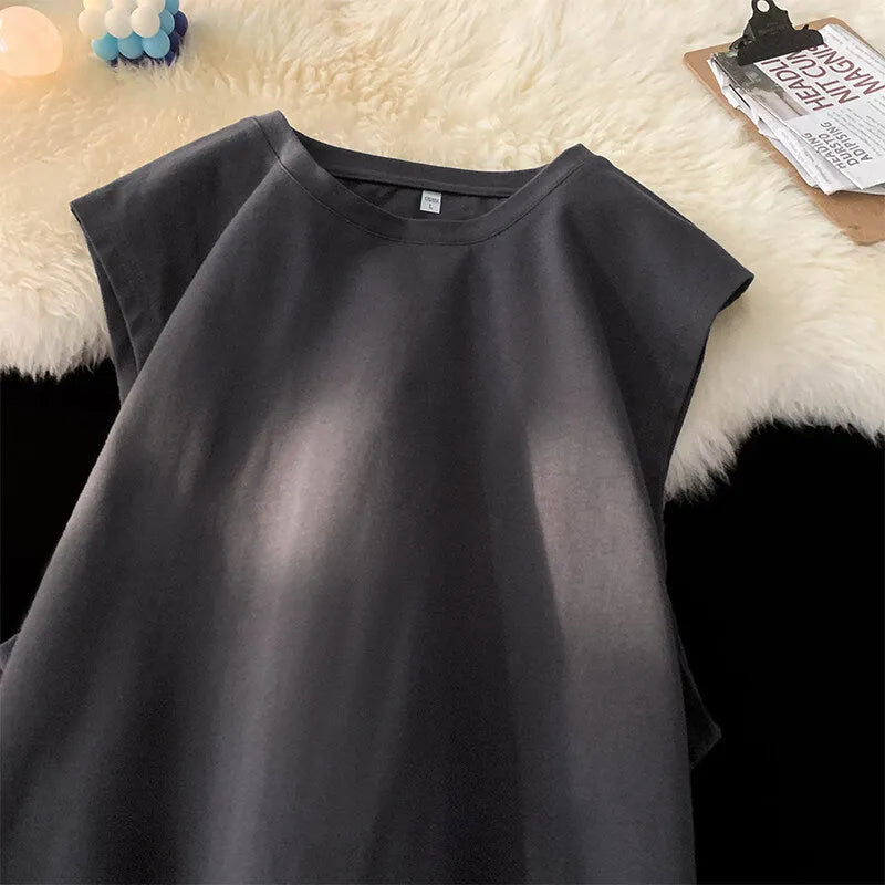 Men's loose solid colour cotton tank top sleeveless t-shirt on a hanger.