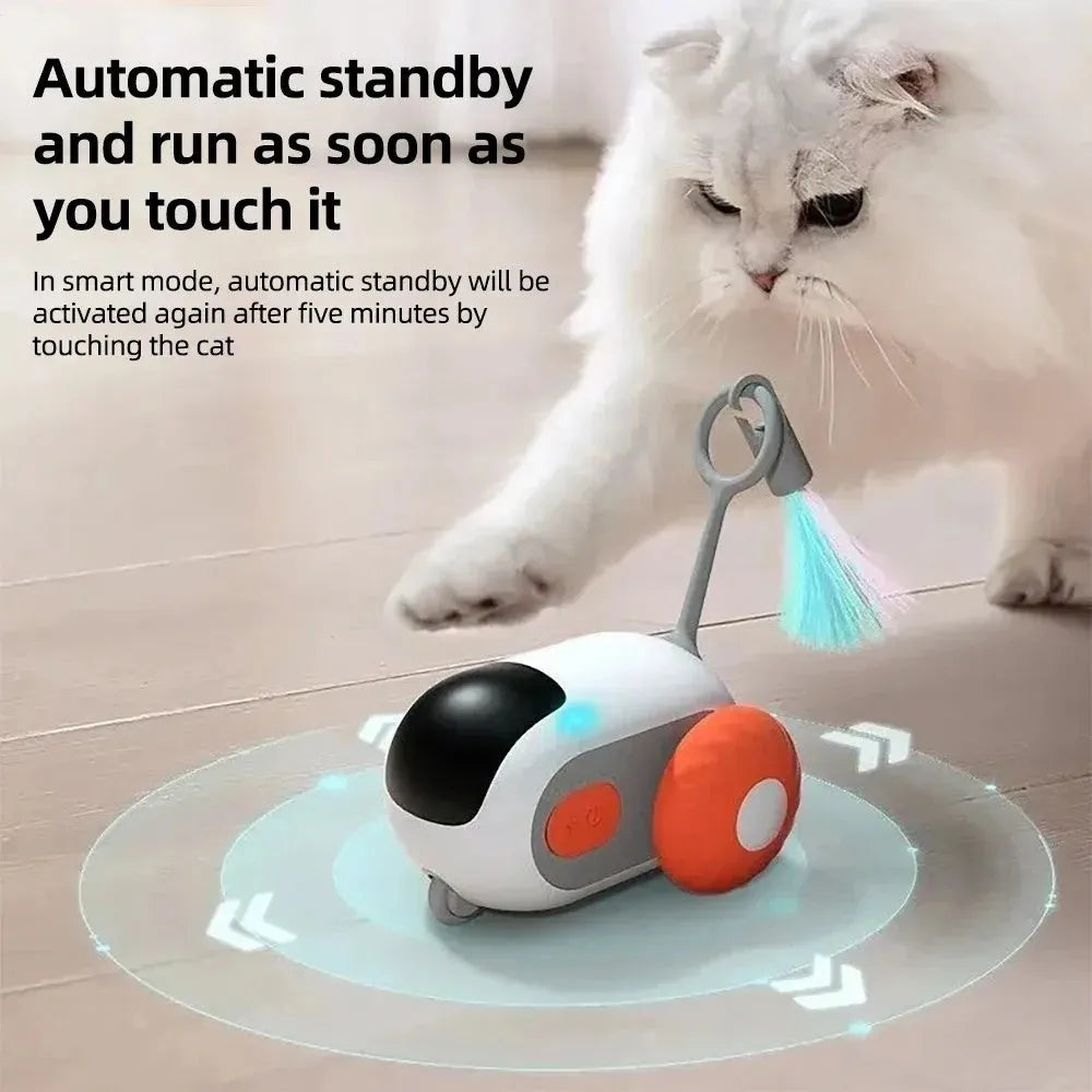 Smart electronic cat toy car with feather attachment and remote control on blue background